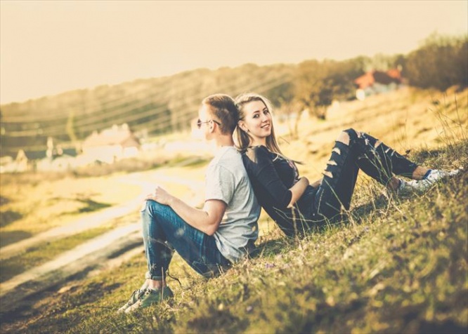 Girlfriend with her boyfriend outdoor in the forest