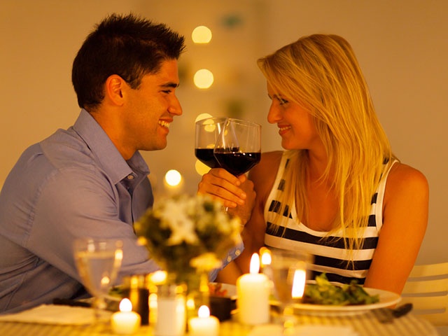 loving young couple enjoying a glass of wine