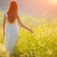 Bride Enjoying Nature. Free Happy Woman. Lit evening sun. Freedom concept.