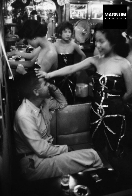 JAPAN, 1958. The Albion cabaret in Tokyo. This was one of the most popular places for F.I.S. Waitresses, all in sexy dresses or shorts, greet customers with shout of welcome. Current american musical favourites fill the air.