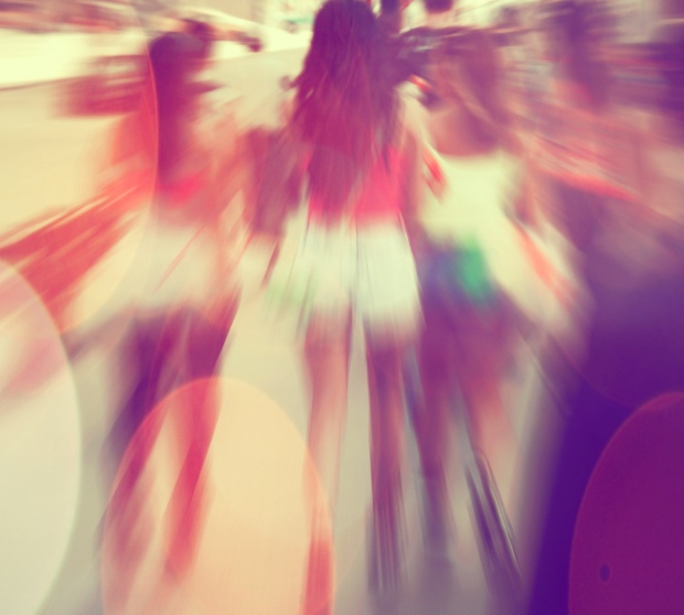 Commuters crossing at rush hour, blur motion.