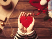 Woman holding a heart shape toy