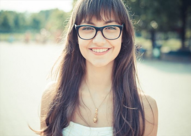 beautiful young woman with white dress in the city