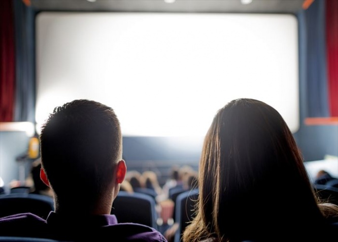 Group of people at the cinema watching a movie