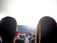 Group of people at the cinema watching a movie