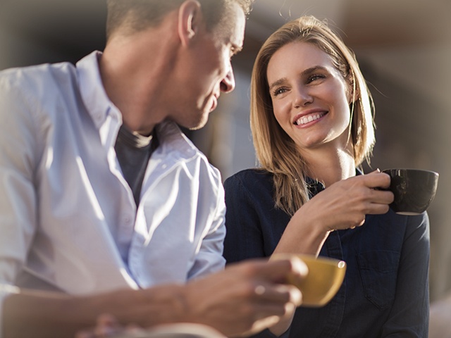 Happy couple drinking coffee