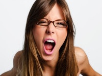 Angry woman screaming on white background