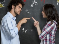 Discussion Between Guy And Girl Over Gray Background