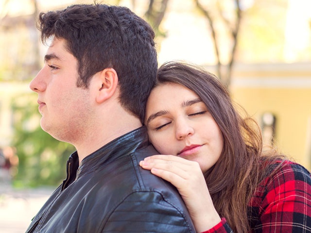 young beautiful couple relaxing outdoors