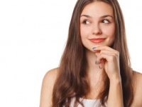 Young beautiful woman thinking looking to the side at blank copy space, isolated over white background