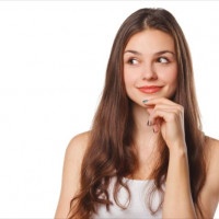 Young beautiful woman thinking looking to the side at blank copy space, isolated over white background