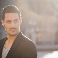 Portrait of a young italian boy posing through the street of the city
