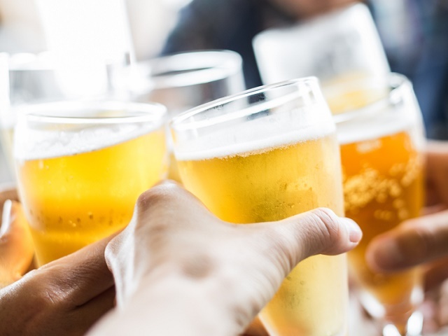 Friends toasting with beer