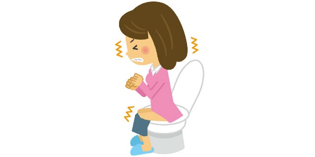 トイレでいきむ女性