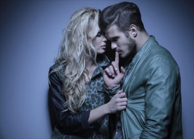 young fashion woman embracing her thoughtful boyfriend