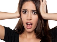 shocked young woman on a white background