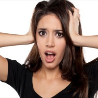shocked young woman on a white background