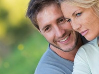 Close up of beautiful couple sitting in the nature, selective focus