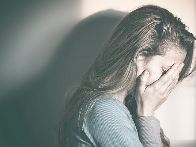 Woman sitting alone and depressed